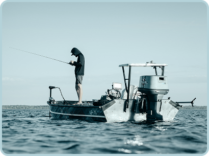 a man fishing off of a boat