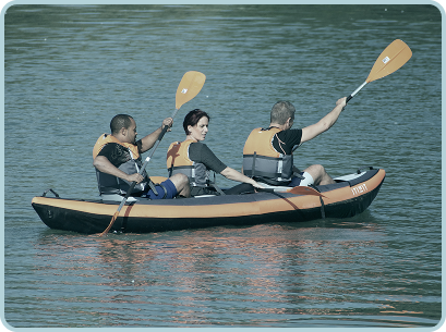 three people in a kayak